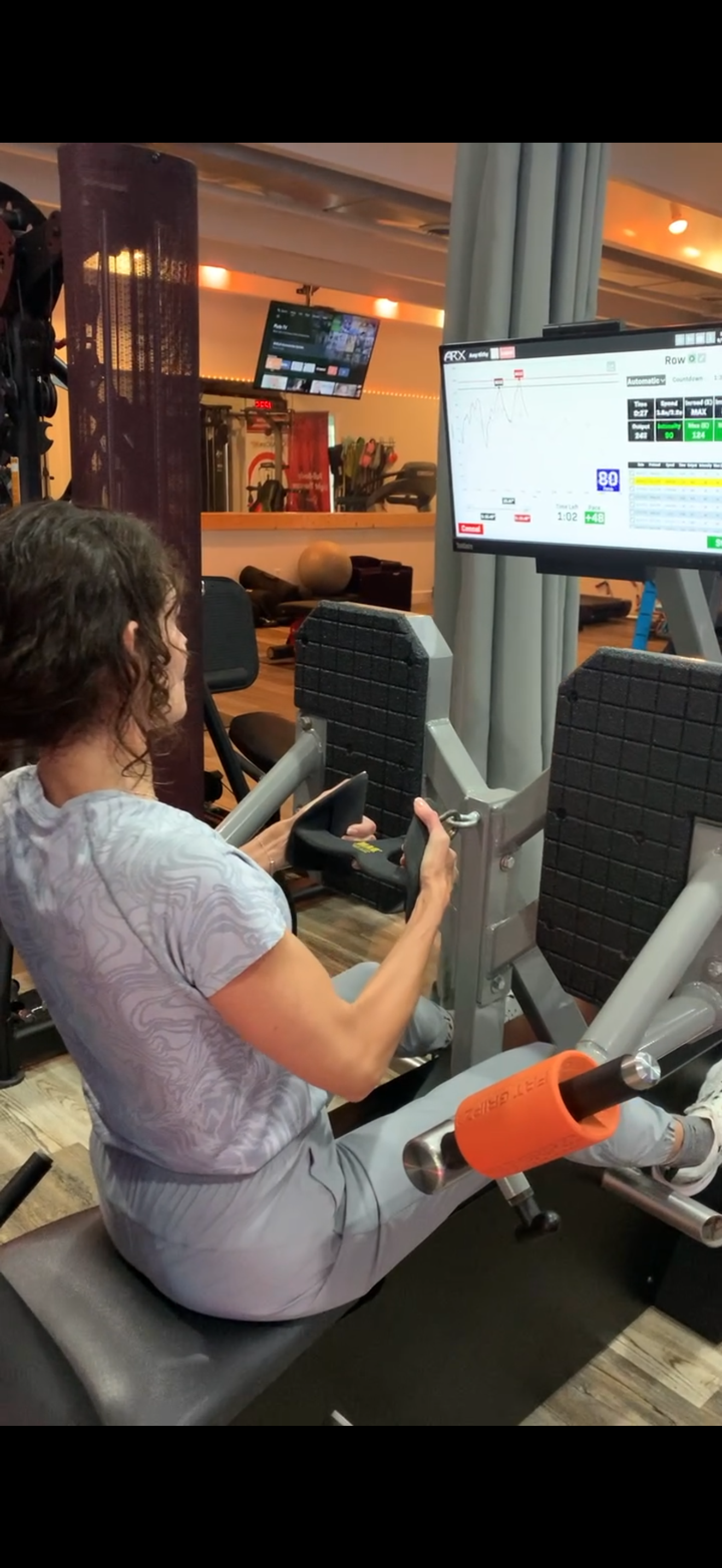 Client performing close grip back row on ARX Alpha at KalQlate Science Hendersonville TN